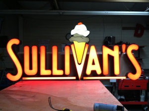 The sign's lighting being tested in shop before installation. 